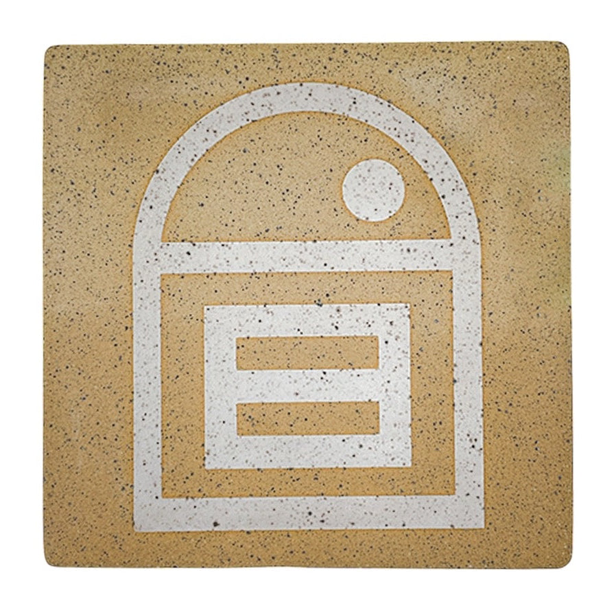 A 4-inch square matte white tile with a speckled stoneware texture and a geometric house-like design in the center.